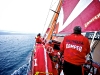 Rob Salthouse helping as CAMPER just manages to escape the clutches of the light air patch onboard CAMPER with Emirates Team New Zealand during leg 7 of the Volvo Ocean Race 2011-12, from Miami, USA to Lisbon, Portugal. (Credit: Hamish Hooper/CAMPER ETNZ/Volvo Ocean Race)